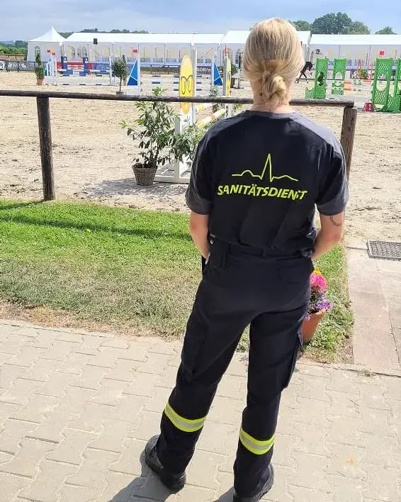 Brandschutz Nolting medic at the warm-up arena of a show jumping event